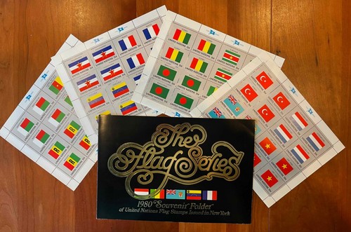 1980 UN Flag Series Set of 4 MNH sheets plus souvenier folder with 16 MNH stamps