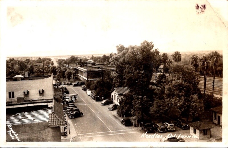 Vintage RPPC Postcard-Needles CA Front Street Scene old cars and buildings