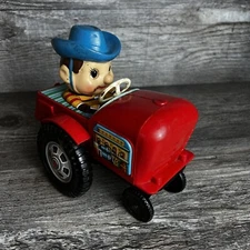 VINTAGE TOY JAPAN ''FARM BOY ON TRACTOR'' MODERN TOYS 1970 PLASTIC WIND UP KEY