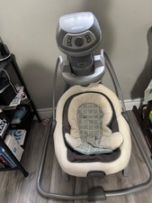 Graco Baby Swing in good condition. Gray and while and blue