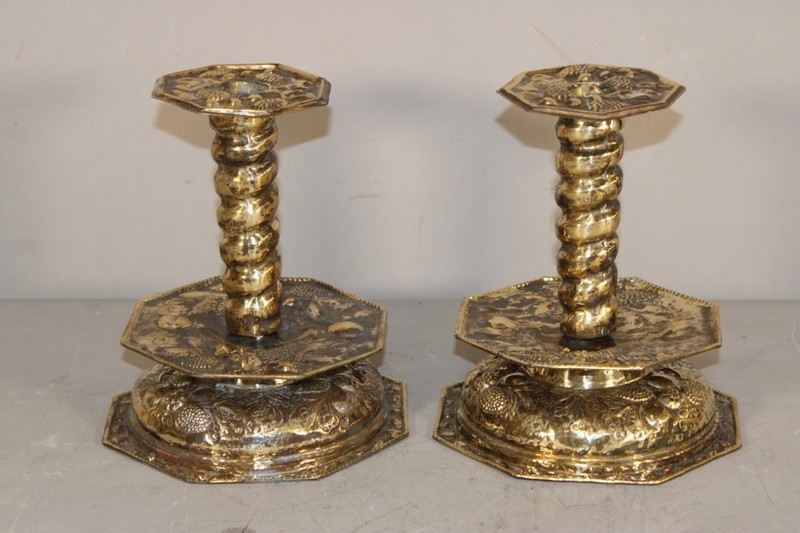 A FANTASTIC PAIR OF 17TH C EMBOSSED AND ENGRAVED BRASS MID DRIP CANDLESTICKS