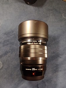 Olympus M. Zuiko Pro 25mm F1.2 Lens with Hood and Case Mint Condition