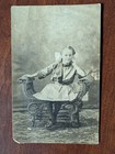 Antique RPPC  Girl Child seated on bench fashion dress bow real photo postcard  — photo 1