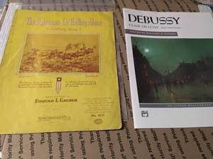 2 Different Sheet Music Booklets ,Debussy and The Caissons Go Rolling On Vg