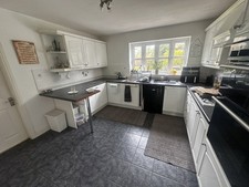 full kitchen, worktops, hob, fan, sink, tap.