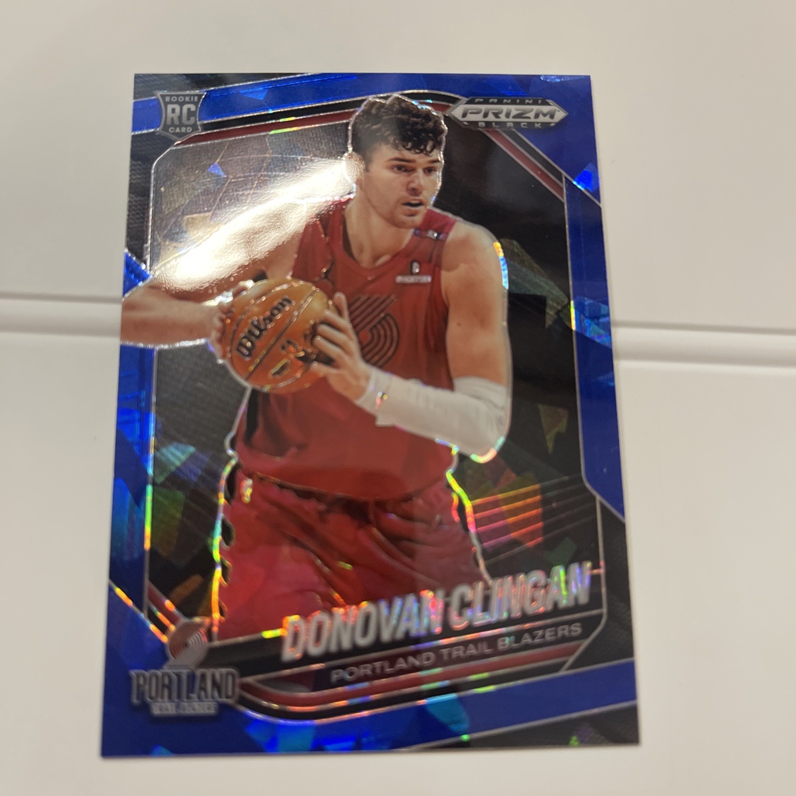 2024-25 Panini Prizm Black #131 Donovan Clingan Blue Ice 73/125. RC FOR BLAZERS