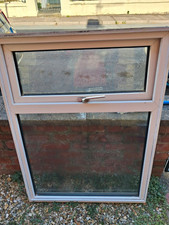 FREE, A White uPVC Casement Window Unit, with top opening and fixed lower pane.