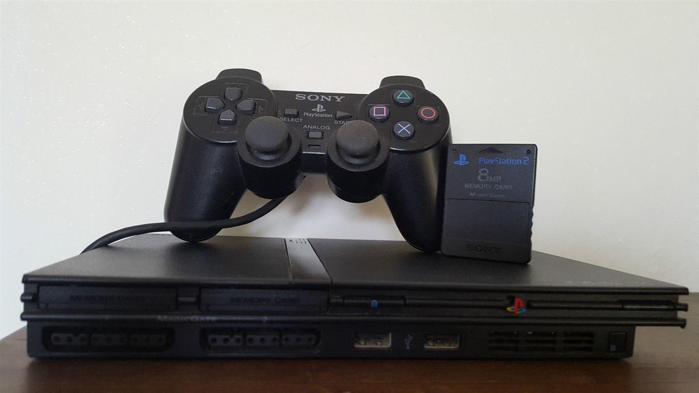 console ps2 slim legge tutto funzionante completo di accessori