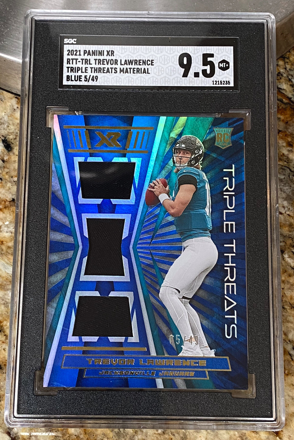 Trevor Lawrence Panini XR Rookie Triple Threats Materials #RTTTRL Blue