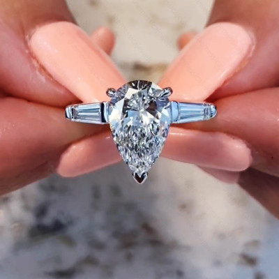 2.39Ctw Pear Cut Moissanite Three Stone Engagement Ring In 14K White Gold Plated