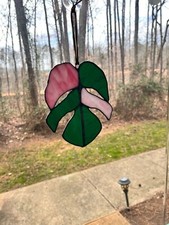 stained glass monstera leaf suncatcher. Green and pink glass