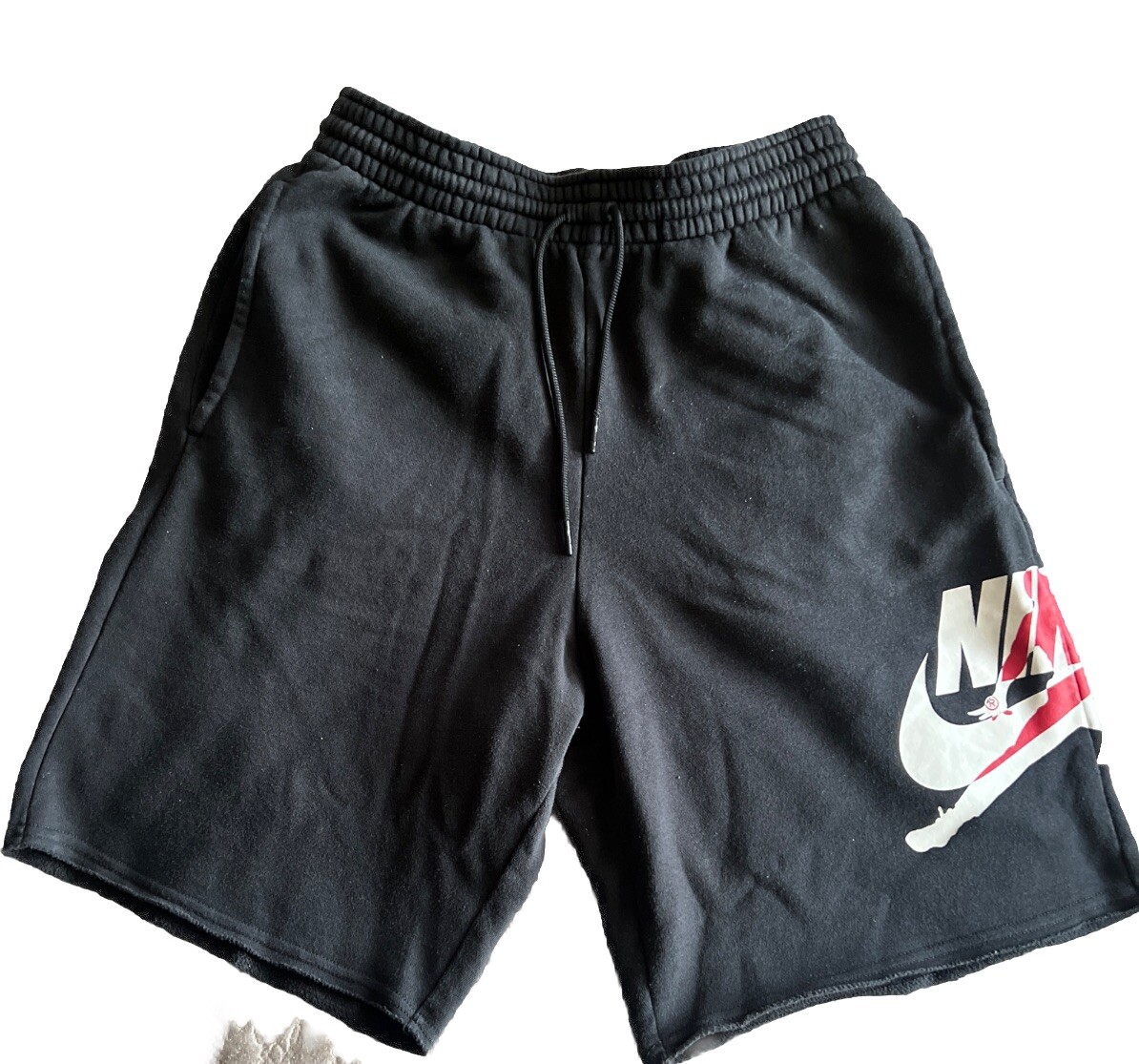 black nike shorts with red stripe