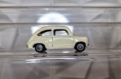 Dinky Toys Fiat 600. Three specimens, two white and one red. Good condition