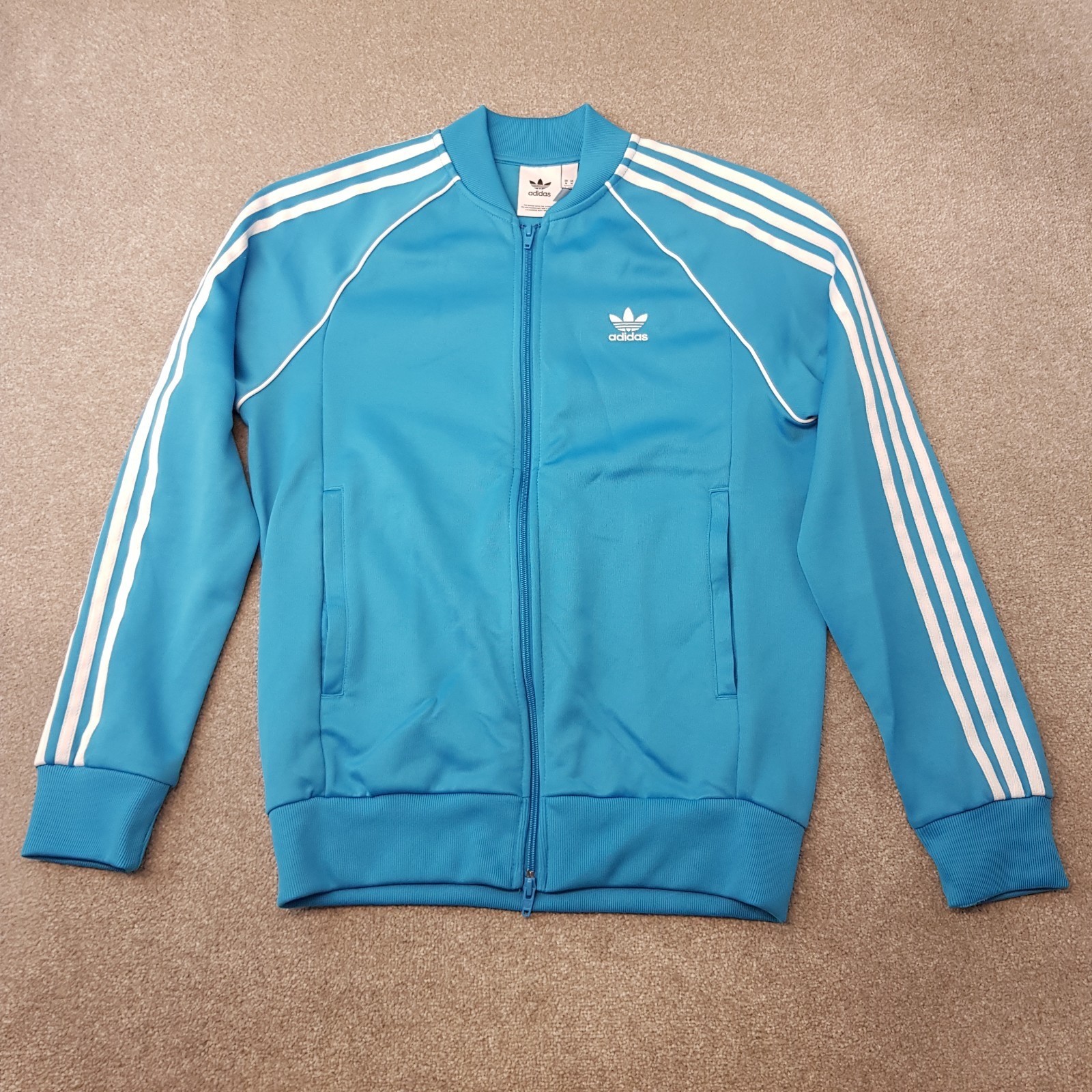 Adidas Clásicos Originales Logotipo del Trifolio SST Azul Cielo Chaqueta de Pista Para Hombre M CW1258