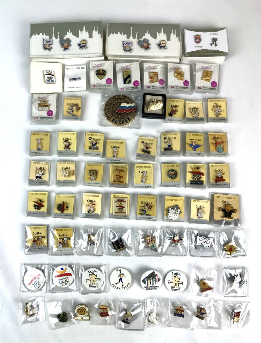 LOT OF 70 PINS AND A COMMEMORATIVE MEDAL. OLYMPICS GAMES