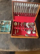 Hundred Piece Stainless Steel ￼ silverware set with serving utensils