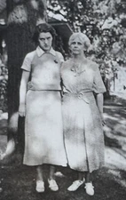 Two Women Posing Outdoors Near Large Tree Nostalgic Fashion 1930s