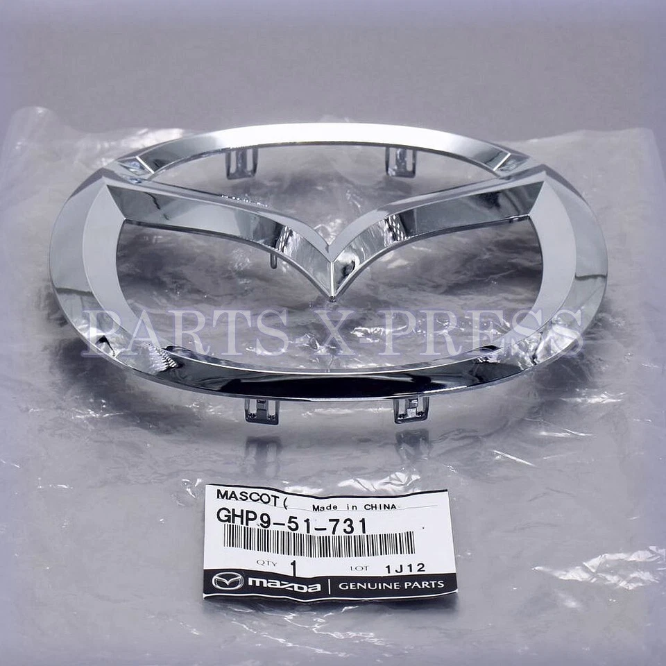 GHP9-51-731 NUEVO GENUINO FABRICANTE DE EQUIPOS ORIGINALES MAZDA 6 2014-2017 PLACA EMBLEMA REJILLA PLATEADA DELANTERA Foto 2 de 4