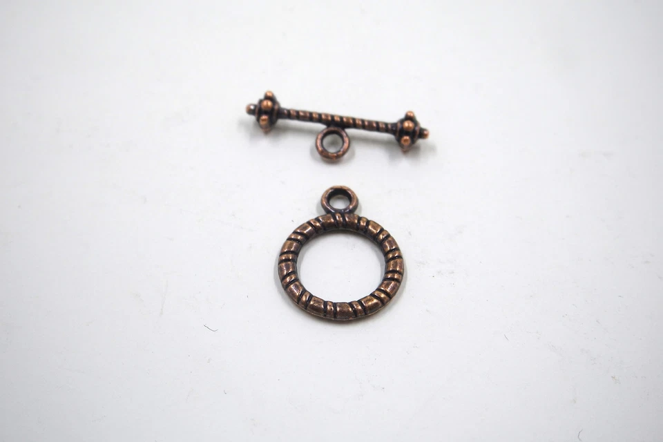 Fecho circular texturizado tom cobre antigo - Imagem 2 de 4