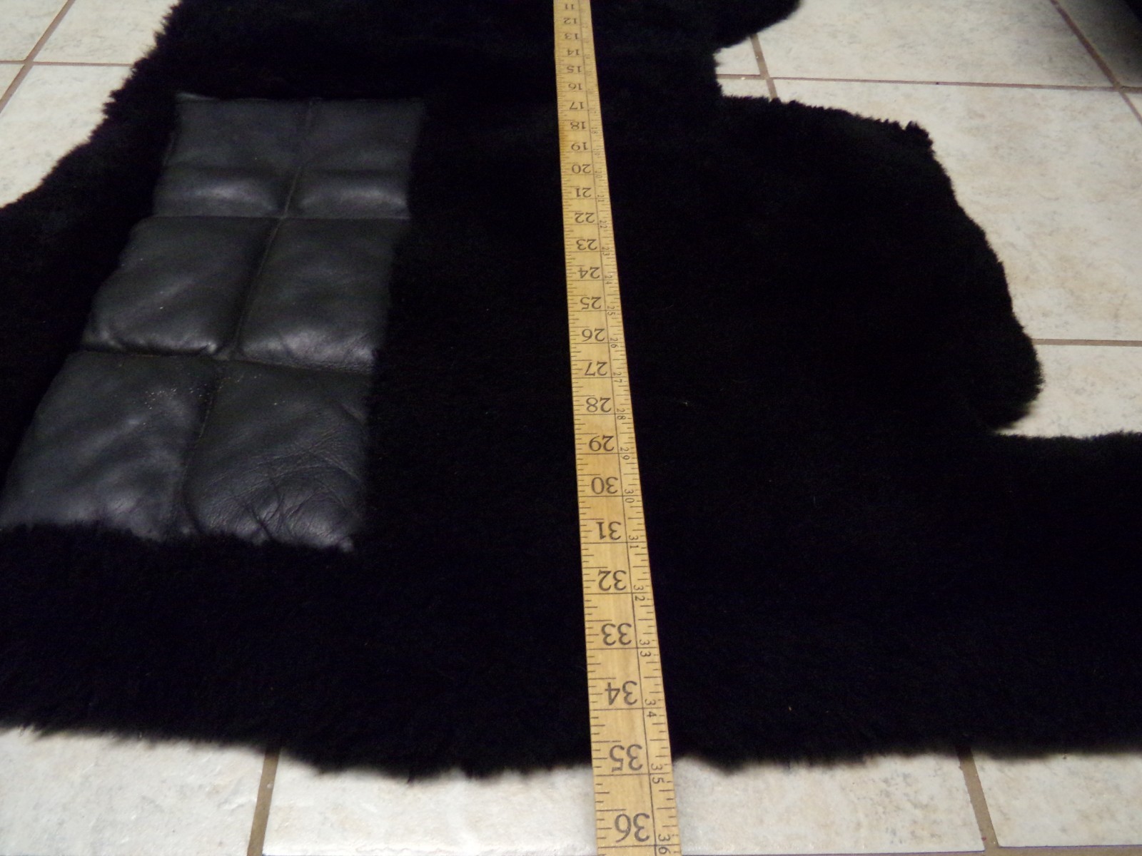 A SET OF 3 ROLLS ROYCE BLACK SHEEPSKIN OVER RUGS by PAUL BLANCHE