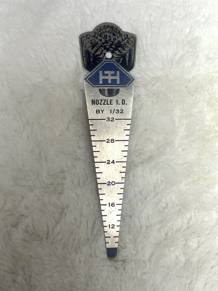 A Hughes Tool Co. oilfield advertising pocket gauge — a legitimate piece of American industrial history that doubles as a conversation-starting desk object.