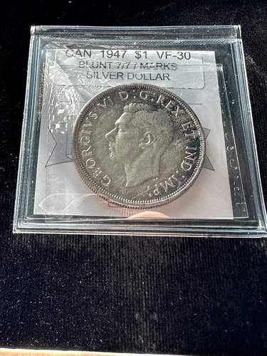 1947  Blunt 7/7  Coin Mart Graded Canadian Silver Dollar **VF-30**