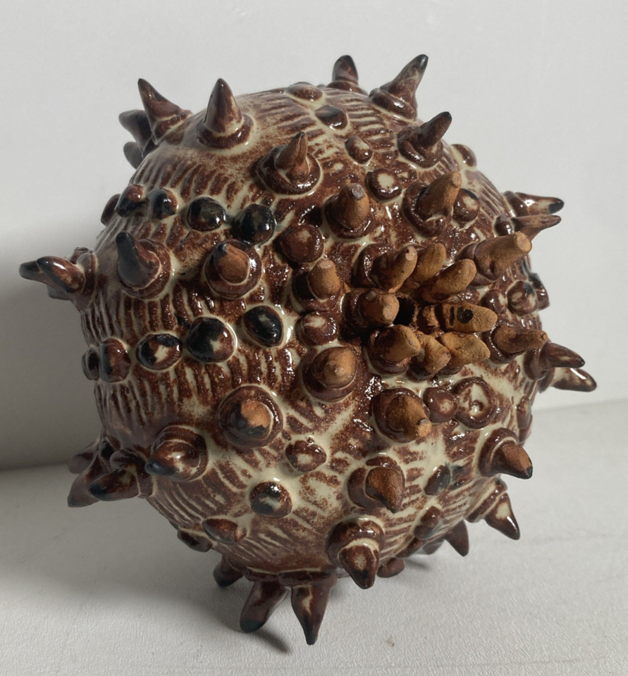 A one-of-a-kind ceramic sculpture that reads like something between a sea creature, alien artifact, and fever dream — genuinely conversation-stopping art.
