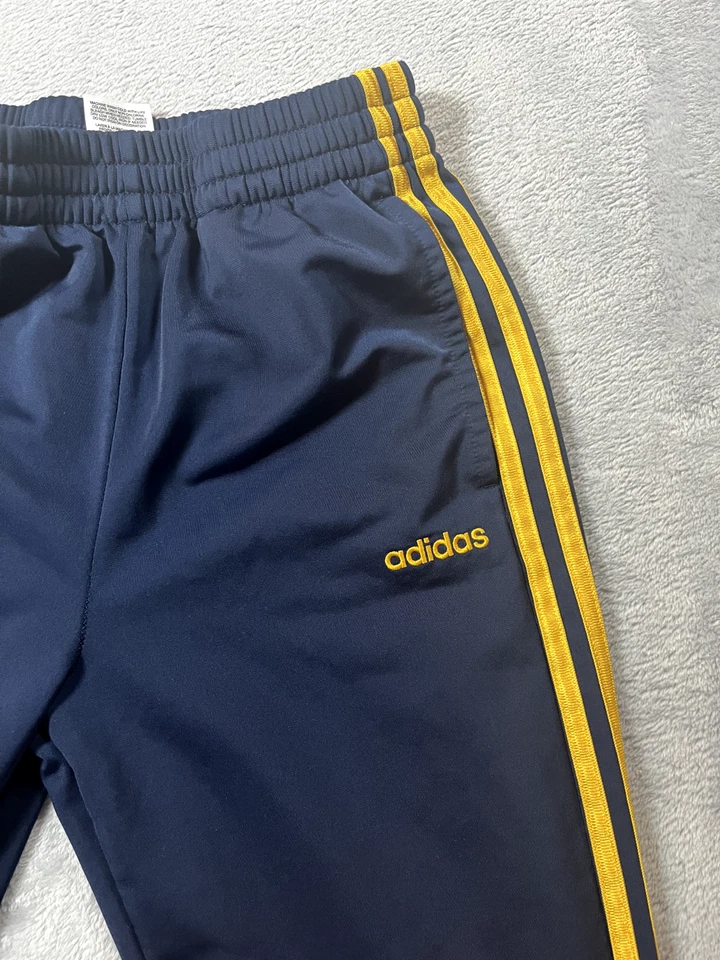 Pantalones deportivos Adidas talla grande azul marino con rayas doradas usados en excelente estado Foto 4 de 4