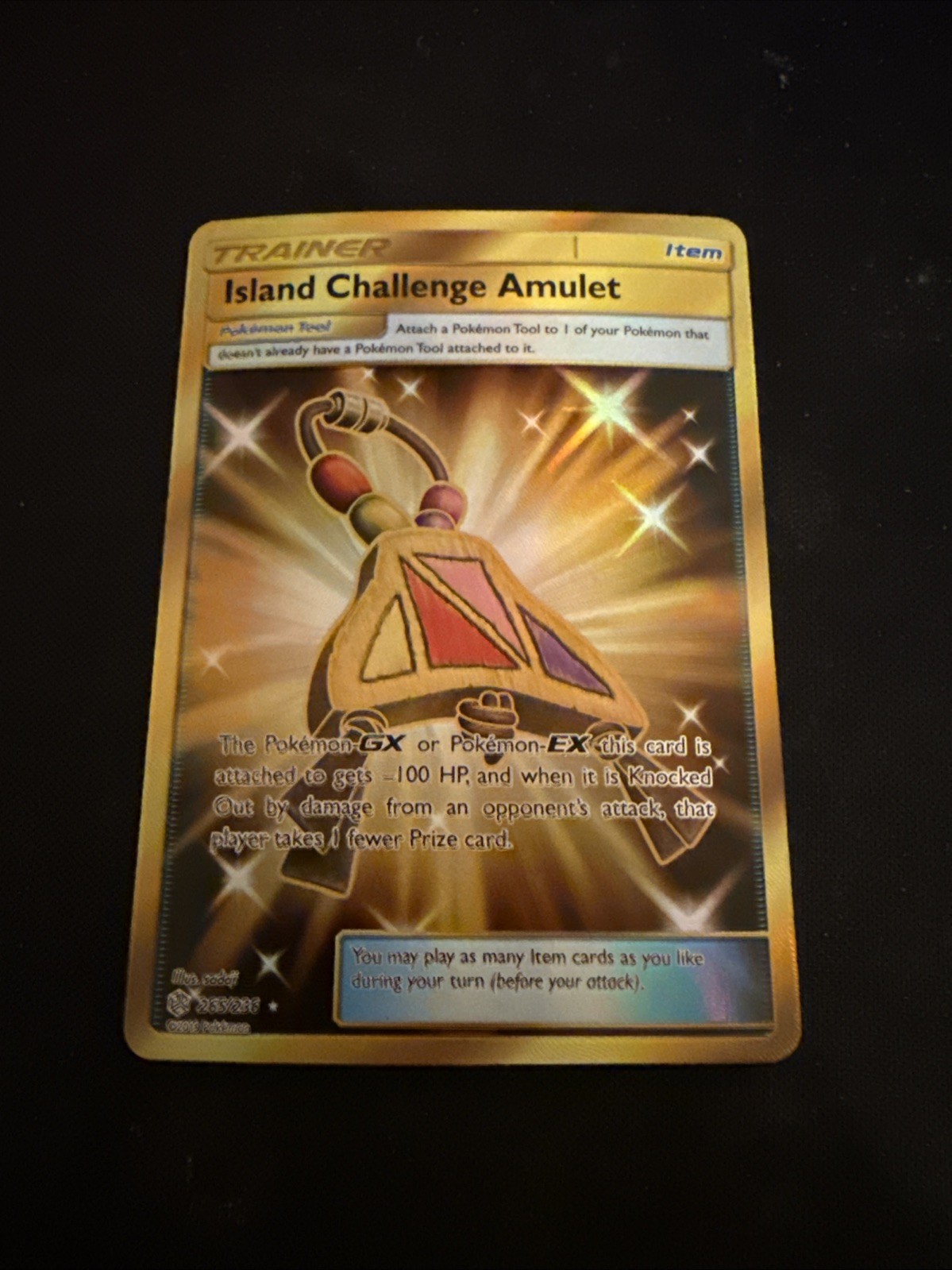 Island Challenge Amulet (Secret) 265/236 Sm-Cosmic Eclipse Holo