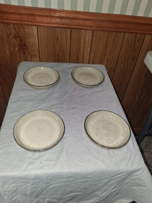 Set of vintage French stoneware dishes with cream glaze and unglazed bases