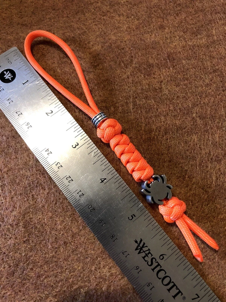 Cordón de cuchillo 550 Paracord naranja brillante con cuentas Spyderco de aleación de titanio. Foto 4 de 4