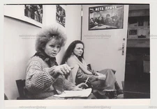 Two Young Women Fight for Their Cause Unusual Posters on the Wall Snapshot Photo