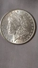 1889 Morgan Dollar (Raw) with A Scratch across the face rim to rim