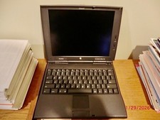 Vintage Macintosh PowerBook 1400cs with two disc drives and all accessories