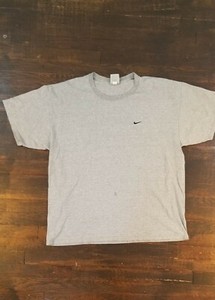 gray and white nike shirt