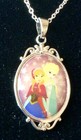 Disney’s ❄️ Frozen❄️ ELSA and ANNA oval pendent with decorative top/bottom — photo 1