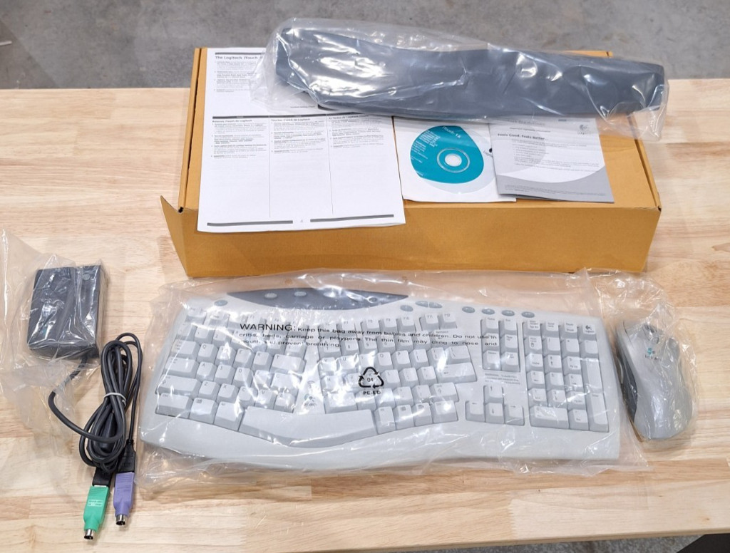 Logitech Cordless ITouch Desktop Pro Keyboard + MouseMan Whe