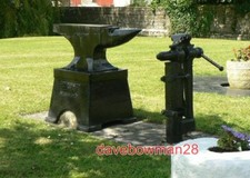 PHOTO  BLACKSMITH'S ANVIL AND VICE ON THE GREEN AT LLANMAES.  2008
