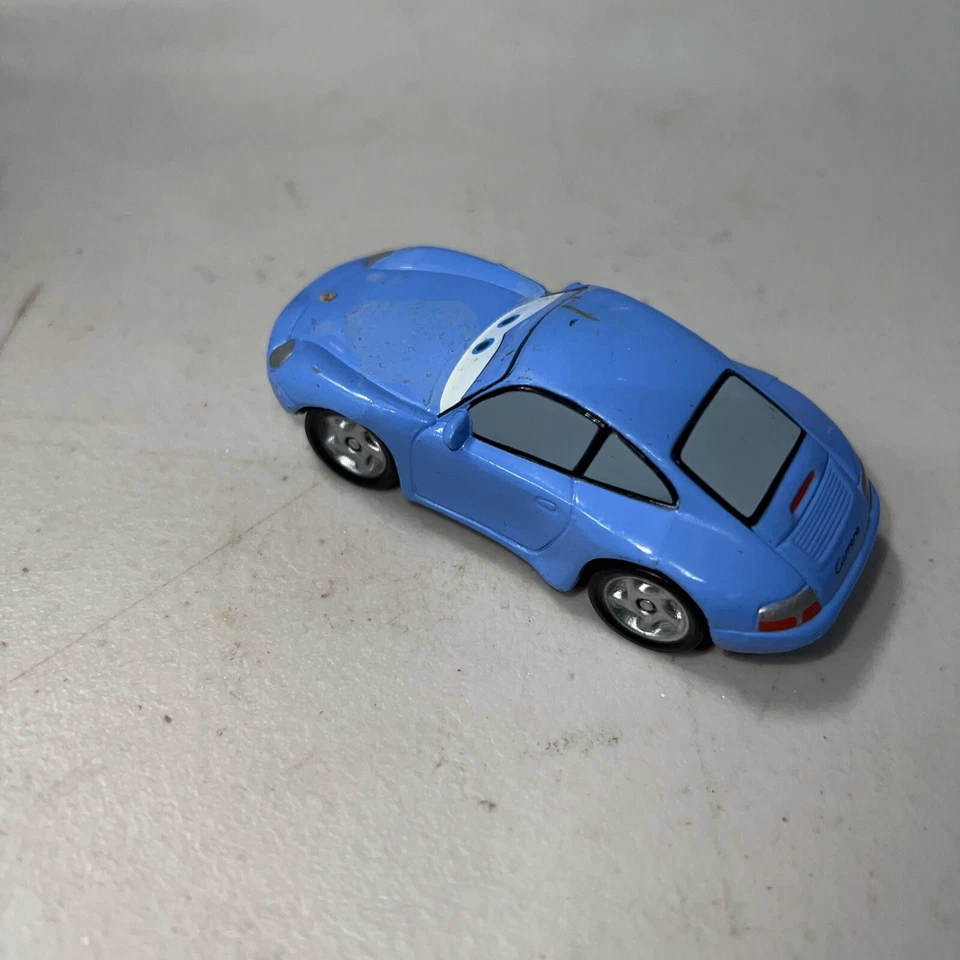 Coche de plástico Disney Pixar Cars Porsche 911 Sally escala 1:55 % Foto 3 de 4