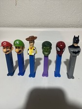Collectible Line Up Of Pez , From Mario To Batman