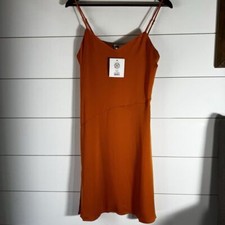Lita by Ciara 100% silk mini Color Amber glow size M. Retails for $248. NWT.