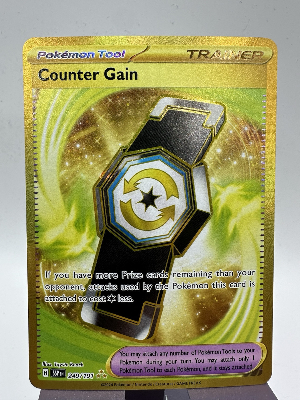 Counter Gain 249/191 Pokémon Sv08: Surging Sparks Holo NM