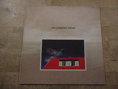 Jan Garbarek Group Photo With Blue Sky, White Cloud,Wires,Windows And A Red Roof