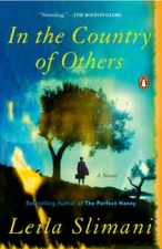 In the Country of Others: A Novel - Paperback By Slimani, Leila - VERY GOOD