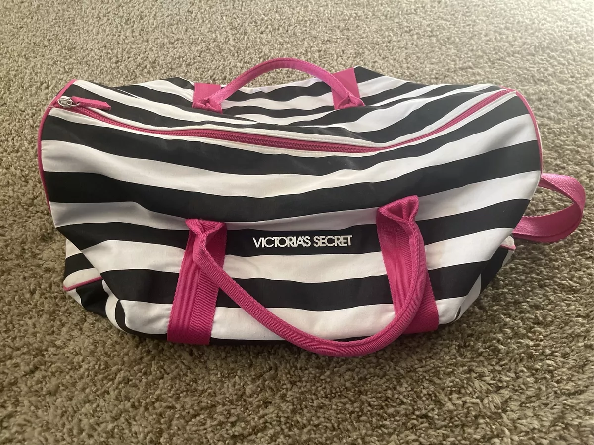Pink duffle bag black and white sales