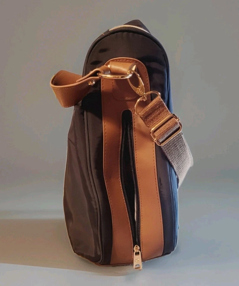 Bolsa de pañales Skip Hop curva detalles azules y marrones dorados con correas para cochecito Foto 2 de 4