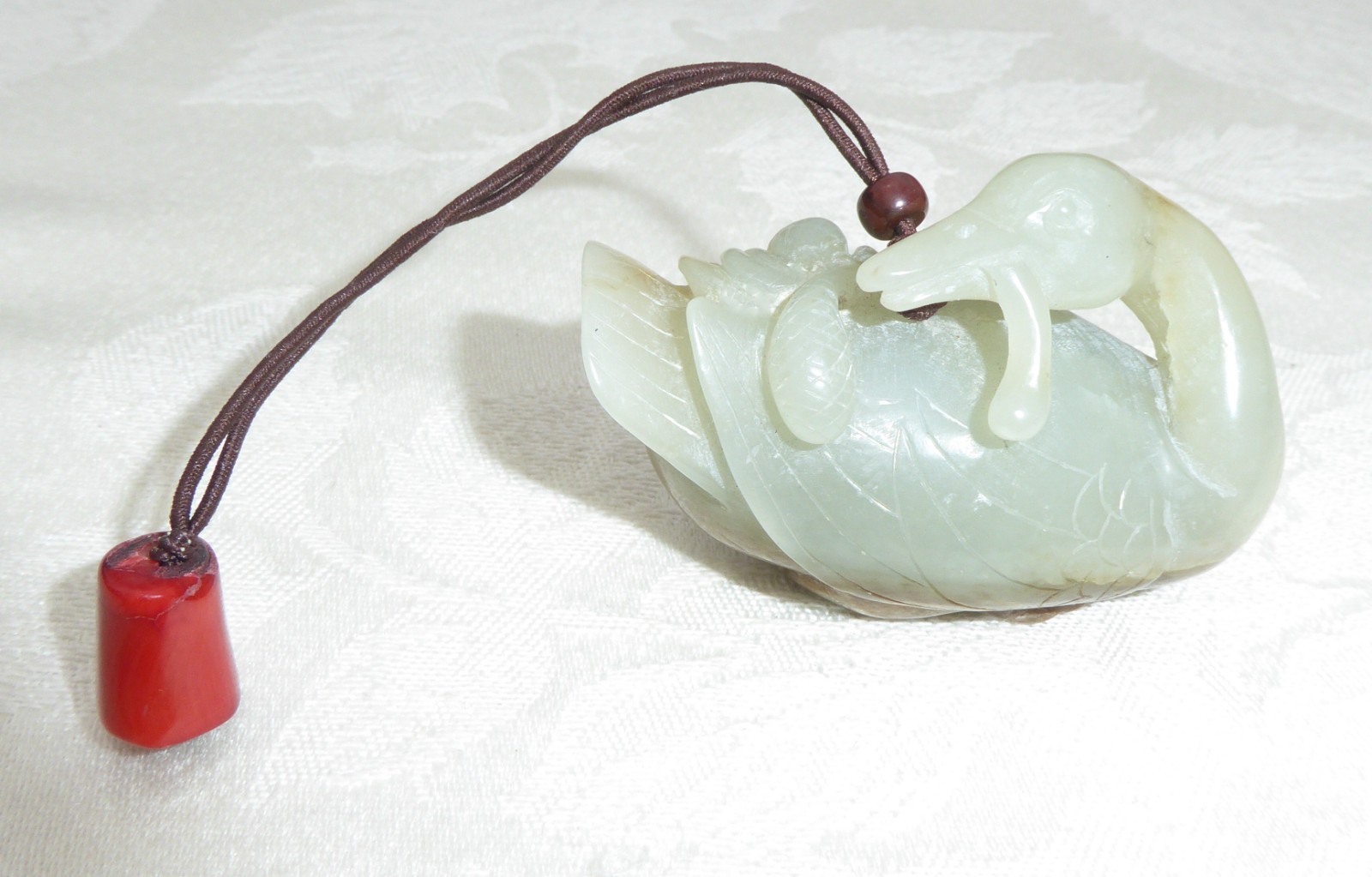 Chinese Natural Hetian Jade Nephrite Carved Duck with toggle and coral on end