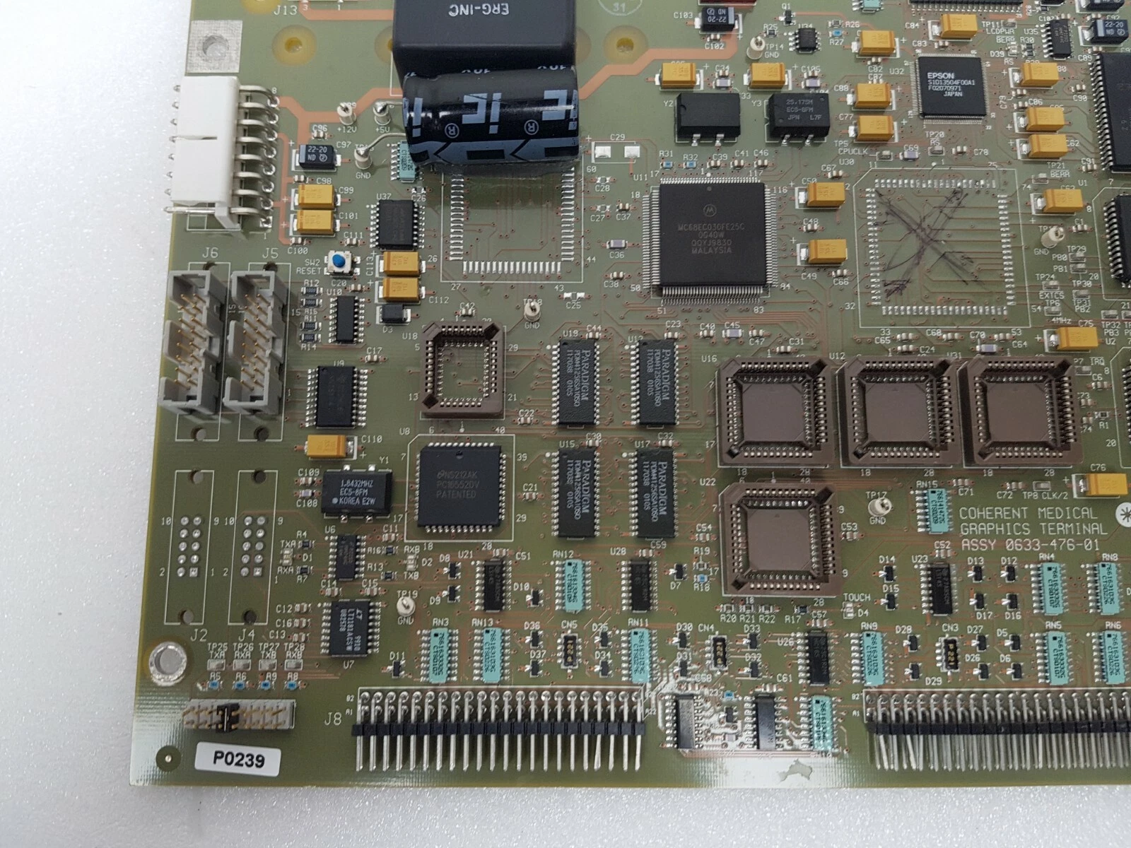 Lower left of the board with J8 header, empty socket U18 and P0239 tag