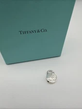 Tiffany & Co Sterling Silver New York Notes Round Padlock Charm Pendant