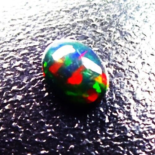 6.85 CTS NATURAL MILD COLOR PLAY OVAL CABOCHON ETHIOPIAN BLACK OPAL - Picture 1 of 2